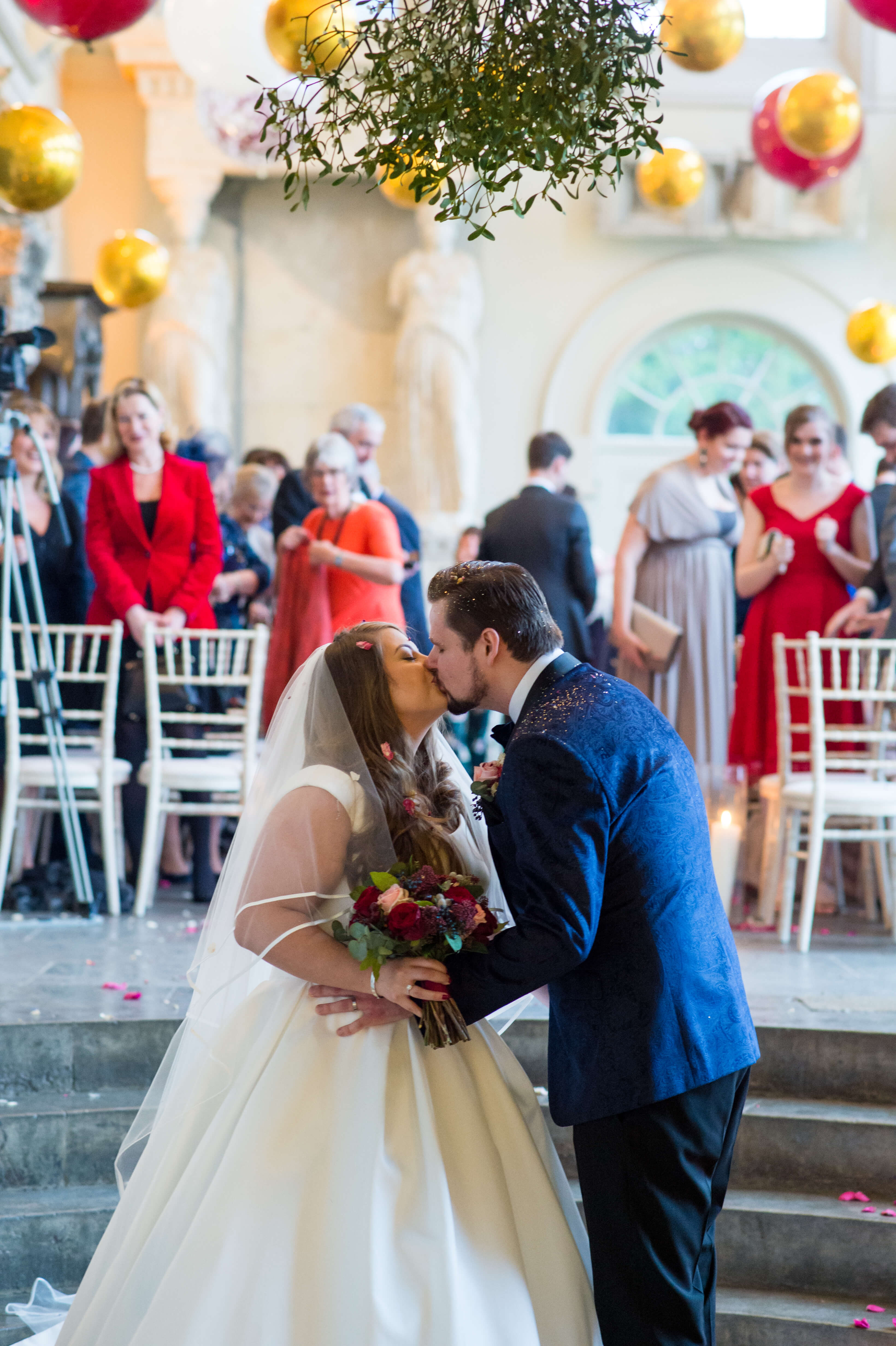 The bride and groom kissing at aynhoe park
